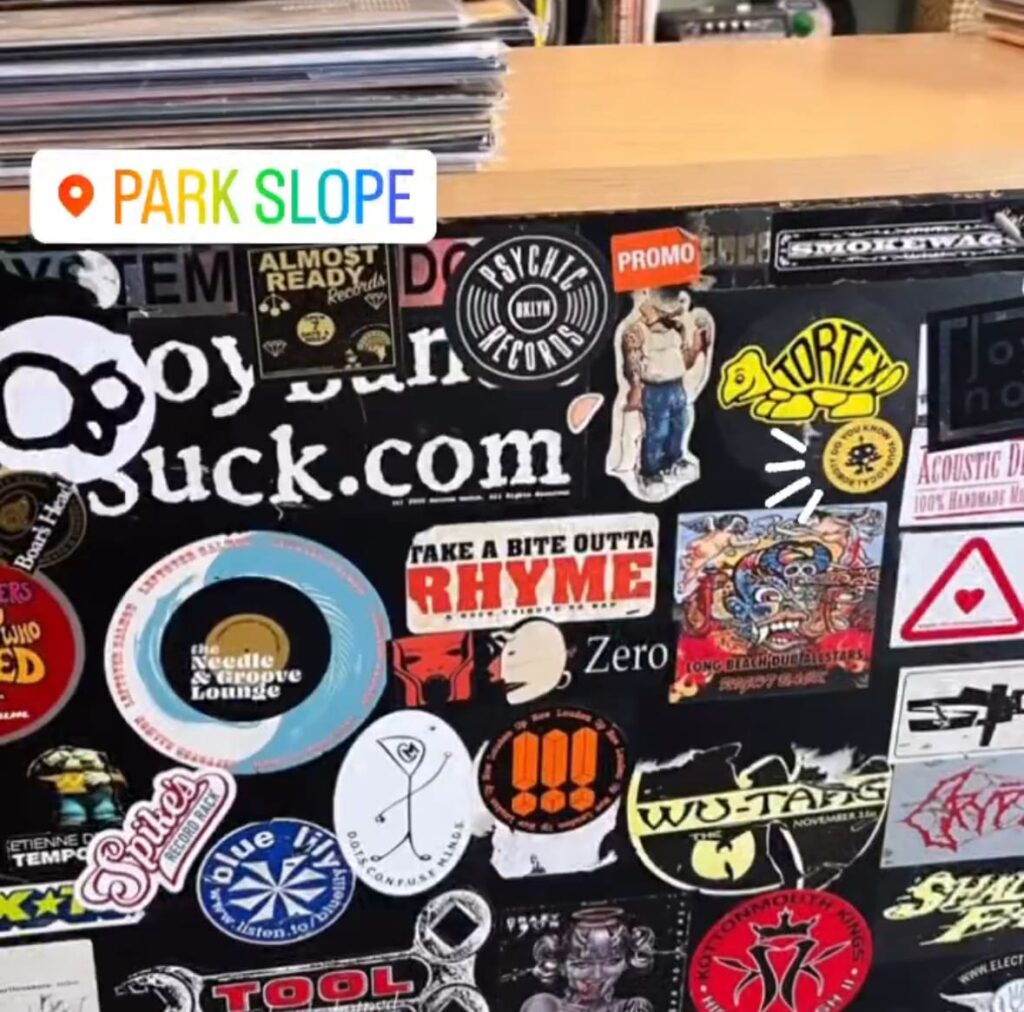 Stickers on a surface in Park Slope featuring "Do You Know Your Local Robot?" sticker